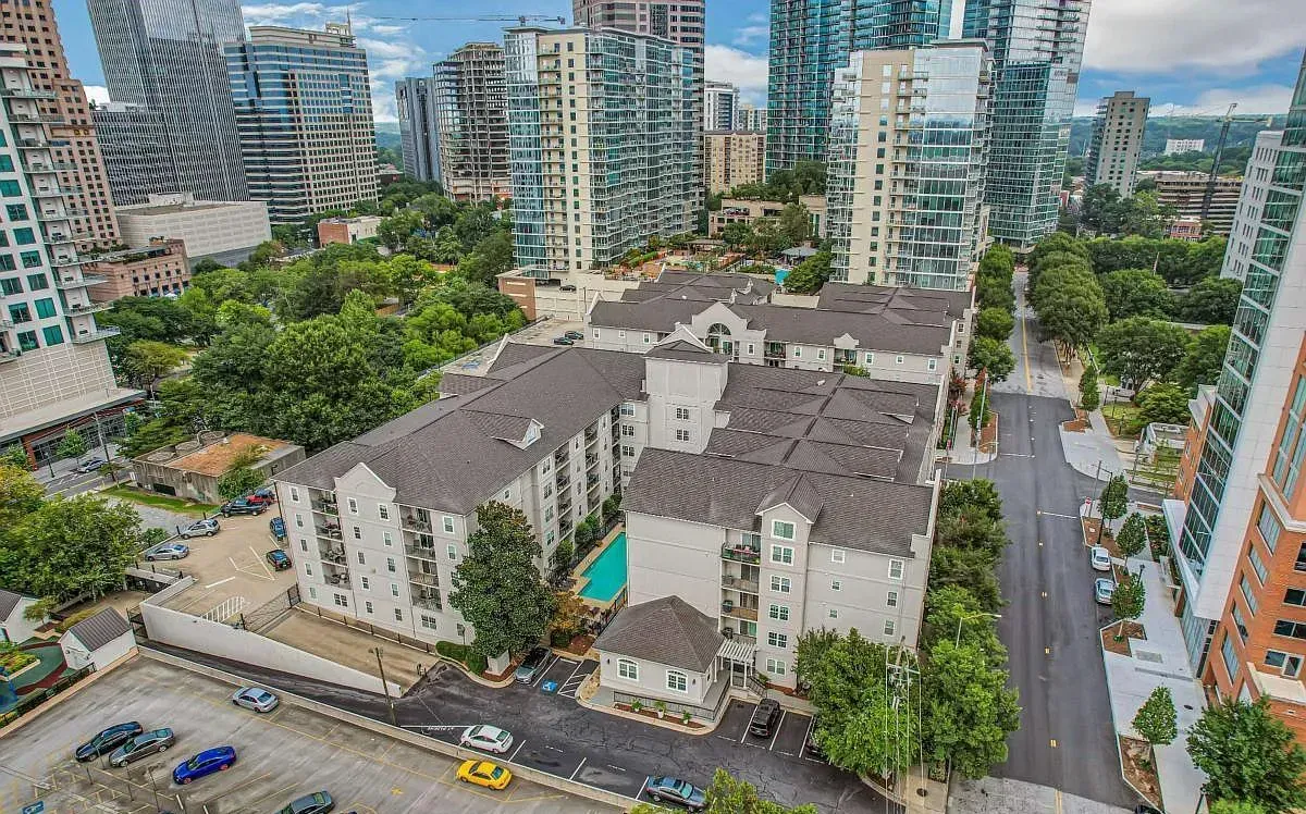 Aerial view of Peachtree Walk, a gated mid-rise condominium with landscaped courtyards, set among the towers of Midtown Atlanta