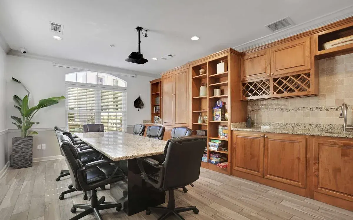 The reservable conference room with a granite table and projection
